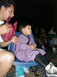 Image: X-Men draw large crowd:Four-year-old Thomas Jaramillo-Ochoa dressed up in honor of watching the X-Men movie with his dad, Ruben Solis.: