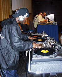 Image: Hip Hop culture celebrates with musical olympics:Grand Wizard Theodore mixes at the Hip Hop Olympics.: