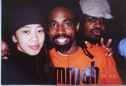 Image: Concert features best in hip-hop culture:State Hornet Hip-Hop critic Tina Jamias (l) takes a picture with Jurassic 5 member Akil (middle) as a party crasher (r) joins in.: