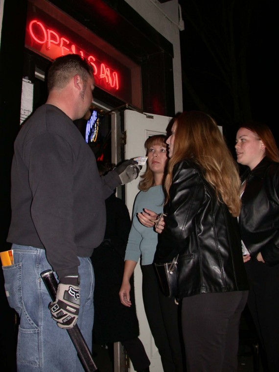 Image: I.D. Check:Photo by Natalie Morris/State HornetA bouncer checks identification outside The Zebra Club in downtown Sacramento. Though many area establishments check for I.D., some don?t.: