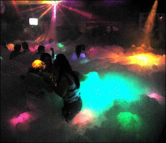 Image: Foam parties bubble with fun:Photo by Jason Lehrbaum/State Hornet The dance floor of Polyesthers is covered with six feet of foam and hundreds of local partygoers. :