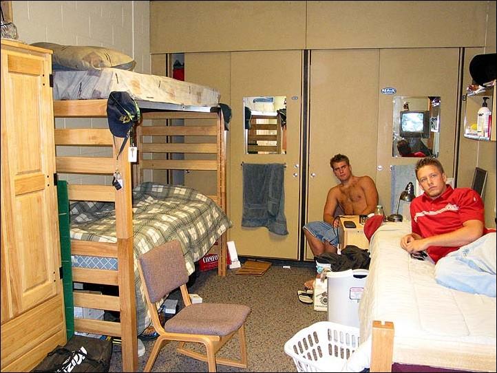 Image: Residence halls packing em in:Travis Wilczynski (right) and Jeff Given (left) share a dorm room with Ben McKenna (not pictured). Rooms like this one, originally built for two residents, now house three.Photo by Jason Lehrbaum/State Hornet: