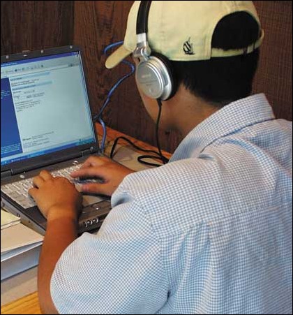Image: Rip, mix, burn...steal?:Photo by Rachelle SterlingState HornetA student listens to mp3s on his computer while studying in the University Union. :