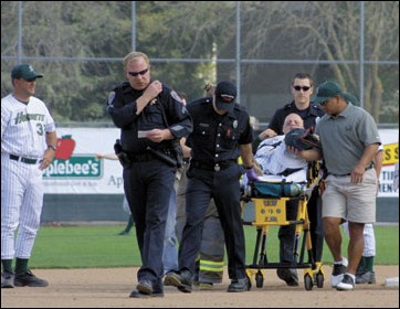 Image: Sac State splits series with Big Green:Hornet starting catcher Corey Watts is rolled off on a stretcher by paramedics after fracturing his fibula sliding into second base.: