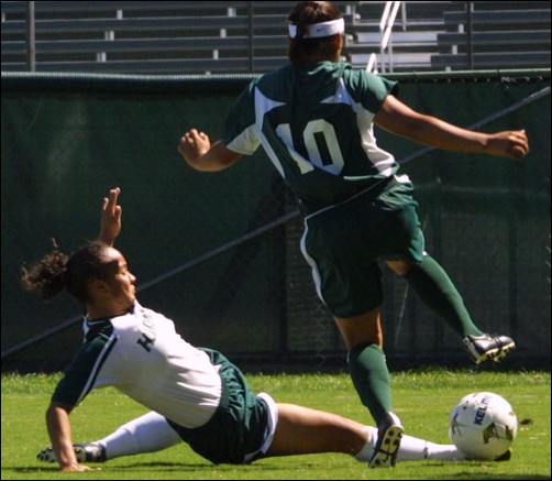 Image: Ducks Dominate:Sacramento state fell to the Pac-10s Oregon Ducks on Sunday. Sela Suarez, pictured here, attempts to slide tackle Andrea Valdez, who took one shot on goal.: