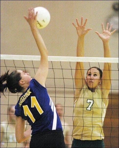 Image: Hornets adjust to lineup changes in wins:Shannon Arts, No. 7, right, attempts a block on Northern Arizonas Ellie Butterfield during Sac States sweep win Saturday night at the Hornets Nest. Arts is just one of several players adapting to a new lineup becuase of Natalie Melcher and Kristin Lutes: