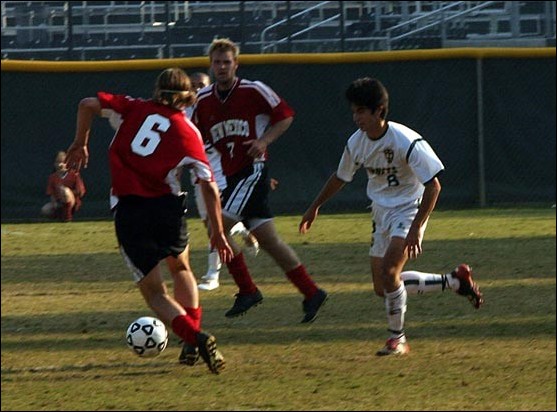Image: Soccer loses to New Mexico:Junior midfielder Marco Ramirez, No. 8, goes after the ball between New Mexicos Jeff Rowland, No. 6, and Brandon Moss in the Hornets 1-0 loss Sunday.Photo by Andrew Nixon/State Hornet: