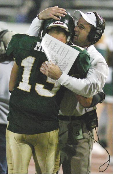Image: Mole returns, runs Hornets over Bobcats:Freshman Ryan Mole is congratulated by head coach Steve Mooshagian after scoring his second touchdown Saturday night. Mole rushed for 245 yards in handing Montana State its first Big Sky loss.Photo by Ken Larmon/State Hornet: