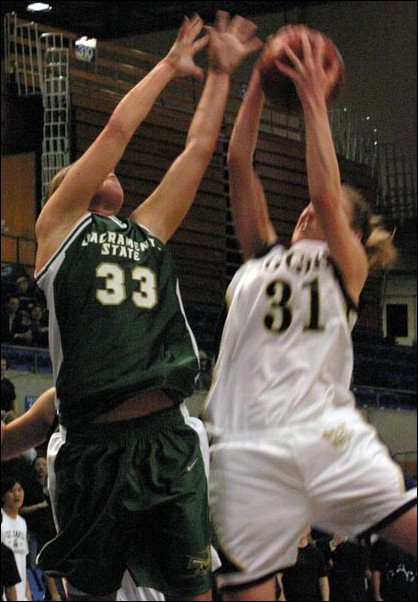 Image: Hornets drop Causeway rematch 74-65:Ashley Cadotte tries to defend UC Davis Jessica Campbell. Cadotte poured in 12 points and grabbed seven rebounds.: