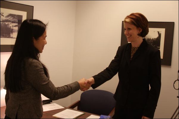Image: Social Security future unsure:Gongpei Gu, left, shakes hands with April Ferguson after completing a mock interview in the Career Center.:Tojo Adrianarivo/State Hornet 