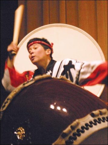 Image: March highlights womens issues:Tiffany Tamarbuchi, a Sac State alumna, leads the Japanese all-women drum group in a February festival.:Andrew Nixon/State Hornet