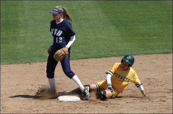 Image: Hornets split two games with Toreros:Second baseman Gloria Toledo slides into second base safely after a double in game one. Toledo was 1-for-2 in the game and had 3 RBIs in game two of a double-header with San Diego.Photo by Matt Swanson/State Hornet: