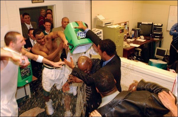 Image: Jenkins contract extended through 2007:Jerome Jenkins is dunked with a water cooler in his office after his Hornets clinched their first-ever Big Sky tournament appearance on March 1, 2003 with a win over Montana State.Photo by Bob Solorio/Sacramento State media relations: