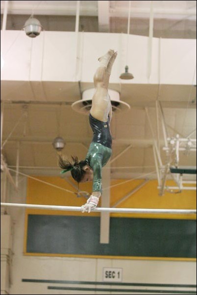 Image: Gymnastics coach likes teams depth:Sacramento State senior Kimiye Narasaki took fifth in the uneven parallel bars with a score of 9.650 on Saturday.  Jim Athey/State Hornet :