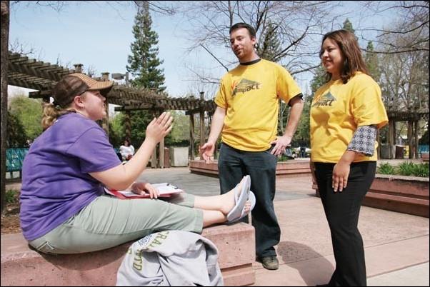 Image: Early presidential candidates announced; campaigns underway :Michelle Dietz (left), a biology senior, talks with Associated Students Inc. candidate for Natural Science and Mathematics director Timothy Jones (center) and presidential candidate Angela Arriola in the Library Quad on Monday. Photo by Andrew Nixon/: