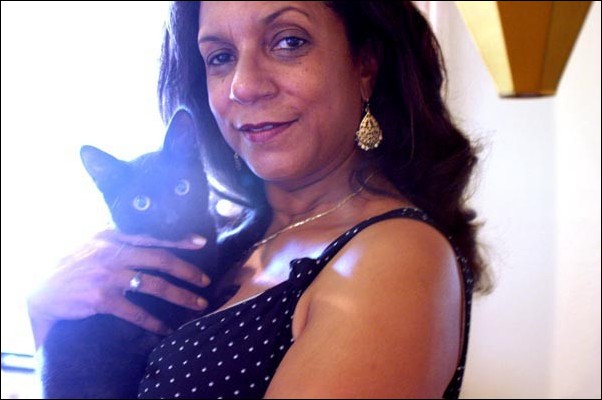Image: Cat rescue is this womans fancy:Ann Dickson with Justice, one of the stray cats she has rescued in her spare time. Dickson and her husband founded Cause for Paws in 1998.Desiree Exline/State Hornet :