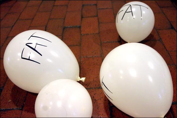 Image: Group presents risks of high-fat diet:White balloons lie in the University Union walkway Thursday afternoon as a group presents to students the risks of a high-fat diet.Photo by Andrew Nixon/The State Hornet: