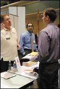 Brian Cassaday receives information from a representative from Chevron. Chevron was one of the many companies in attendance at Wednesdays Career Fair.:Diane DeRemer