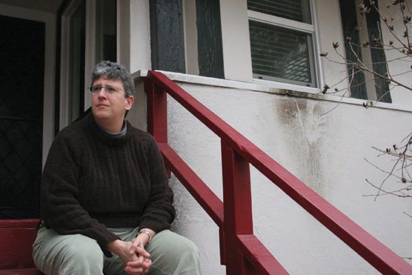 File photo: Assistant professor Beth Kivel poses on the porch of her Oak Park home in January of 2006 where an incendiary device left a mark on the wall. Richard Delton Collins, 46; Tausha Marie Newsome, 35; and Rashikendra Kenny Prasad, 26, were sentenced to three years in prison after pleading no contest to possession of illegal explosives in connection with the firebombing.:
