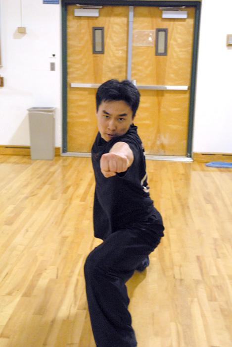 Senior chemistry major Yas Yamamoto practices Wu Shu at the Martial Arts Clubs Tuesday practice last week in Lassen Hall.
