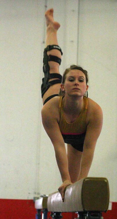 Senior Courtney Hibler practices her beam routine last Wednesday. Hibler will compete in an exhibition on beam on Sunday during senior night at the Hornets Nest. :