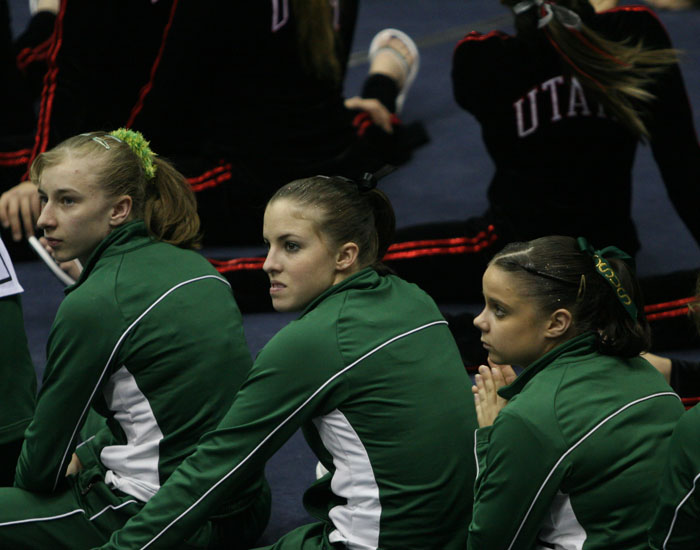Melissa Genovese, right, awaits the final scores of the NCAA West Regional with teammates Marina Borisova, left, and Lissa Zamolo. Sitting behind the Hornets are the tournament winners Utah with a score of 197.325 on Saturday at University of California, Berkeley.:
