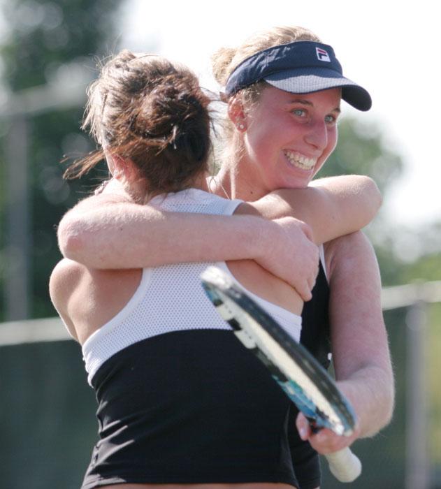 Freshman Katrina Zheltova, left, hugs Sophomore Luba Schifris, right, after clenching the tournament winning point on Sunday, at the Big Sky finals against Northern Arizona. :