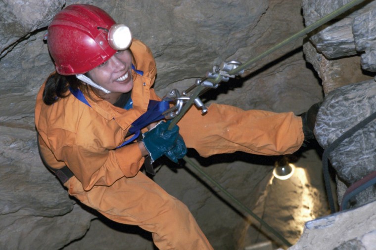 Tina Keller beginning the 165-foot rappel into Moaning Cavern:Photo courtesy: Bill Becher