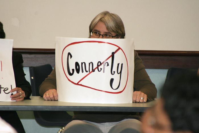 A+faculty+member+holds+a+sign+protesting+Connerlys+speech+against+affirmative+action.%3AJohnson%2C+Steven