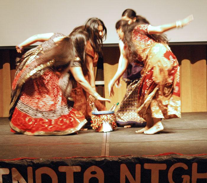 Indian students from the International Students Christian Fellowship dance the Garba, a traditional Indian social dance Saturday in the Redwood Room.: