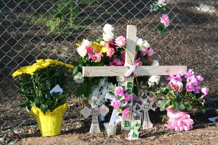 Friends of Kebret Tekle left flowers, sorority paddles and balloons on Friday across from Library Eats and Drinks on Folsom Blvd. The sophomore journalism major was shot in the neck at 1 a.m. outside the bar. Tekle died later that night.: