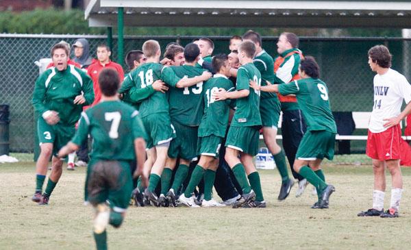 The Hornets celebrate a win and congratulate Eli Millan on making the winning goal in an overtime game against UNLV.: