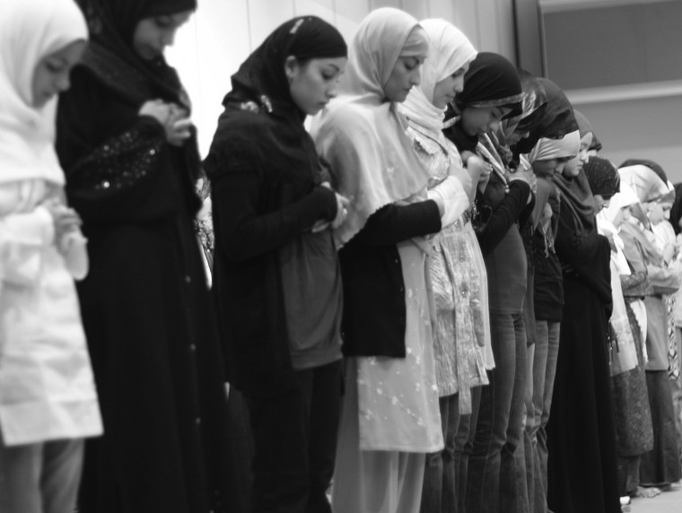 Female students line up in the University Union Ballroom II to pray before breaking their fast.: