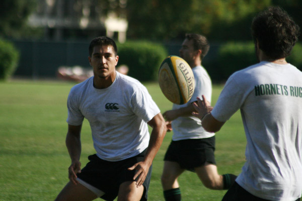 Joe Romo is in position to catch the rugby ball at practice last Thursday at the Sports Recreation field near Hornet Field: