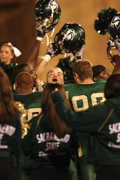 Hornets ran off the field to share their excitement with the cheer leaders and dance team after the 40-31 victory against Idaho State Saturday Nov. 17.: