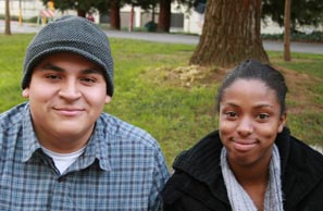 Senior business major Diejo Mejia hangs out with sophomore child development major Shawnica Lewis in between classes by a tree outside of the University Union.:
