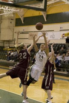 Junior Atty Boyer shoots over a Montana defender during Thursday nights loss to Montana.: