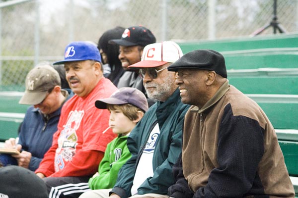 Some of the original players of the Negro League teams, the Larks and the Seals, watch the game on Saturday.: