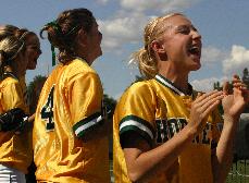 Senior Amy Tompkins leads the team in a cheer during the loss to Cal on April 19, 2007.: