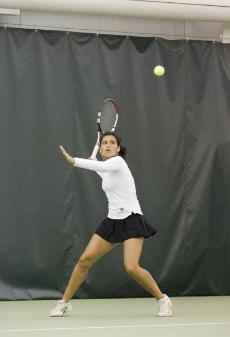 Freshman Melissa Valenzuela keeps her eyes on the ball as she prepares to rip fuzz against Gaucho's player Charlotte Scatliffe in her Saturday singles match.:Derek Adelman