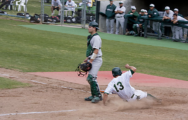 Ryan Blair slides into home plate to give the Hornets a two-run lead in the sixth inning of Sac States game against the Hawaii Rainbows.: