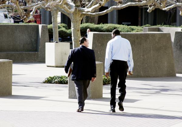 Felton (right) walks out of the Gordon D. Schaber Downtown Courthouse with his attorney Wednesday morning. Felton refused to comment on his misdemeanor charge.: