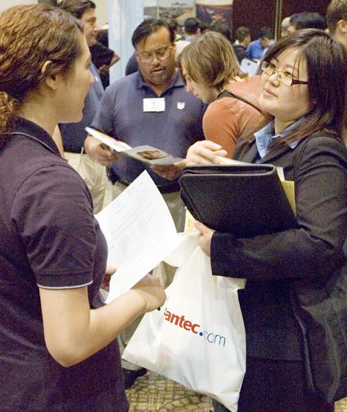 Sacramento State student Annie Chenk, management informational systems major, right, discusses employment opportunities with a Chevron representative at the Engineering and Science Fair on Monday, March 10.: