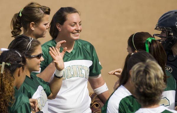 Pitcher Megan Schaefer, middle, smiles after catching a ball straight from the batter in the fifth inning. Sacramento State Hornets played against the Stanford Cardinals on Wednesday at Shea Stadium.: