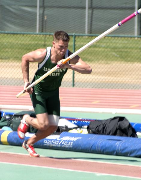 Senior Robert Brazier tilts forward dramatically before running towards the mat in the pole vault during the decathalon at Hornet stadium on Thursday.: