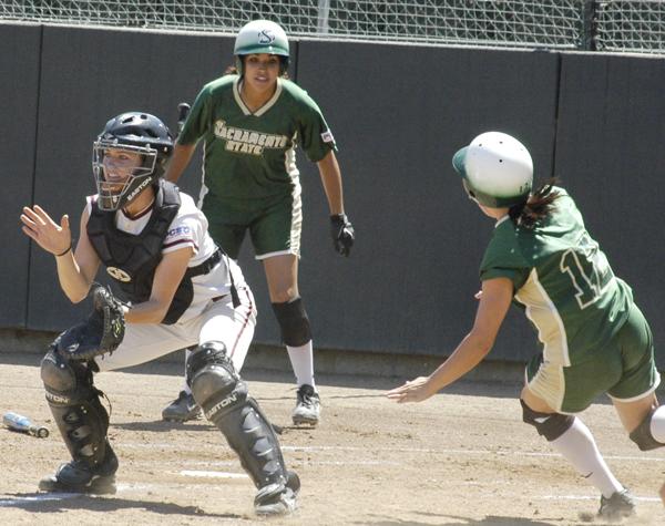 Whitney Loomis runs to home plate, giving the Hornets the lead against Santa Clara in the early innings on Sunday.: