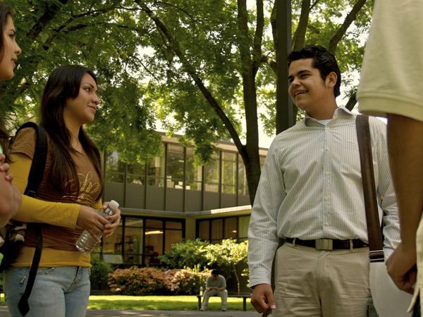 Miguel Cervantes, newly elected ASI president, right, speaks with students from the College Assistance Migrant Program about issues that affect the campus community.: