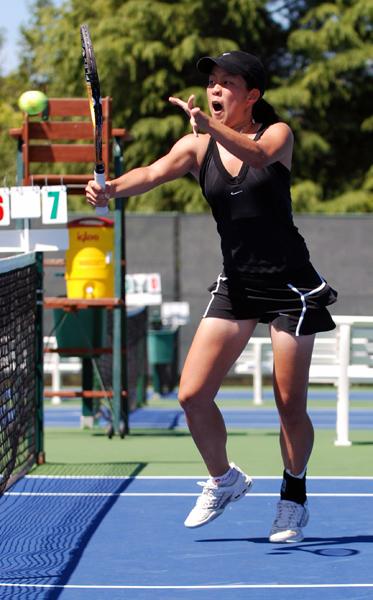Aileen Tsan attacks the net at during the Big Sky Tournament finals in Gold River.: