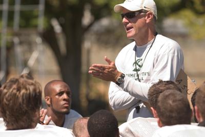 Media Credit: Claire Padgett - Head football coach Marshall Sperbeck speaks to the team after practice on Aug. 21.: