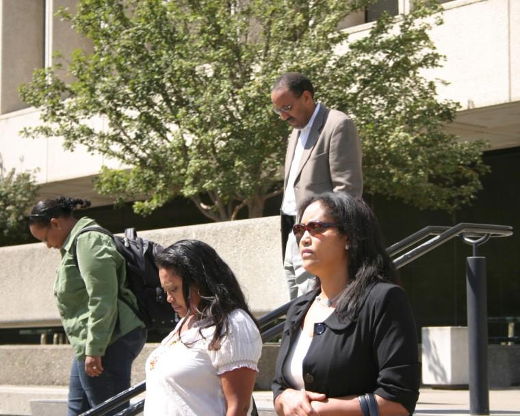 Tekle Sebhatu with his extended family outside the courthouse.Sebhatu said his immediate family was not present because, It is too hard for them, they could not bear it emotionally. :